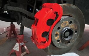 Custom Painted red brake Callipers and reconditioned wheel hub and rotor of VW Amarok at Racers Paint and Panel Brake Caliper Painting Johannesburg painted calipers