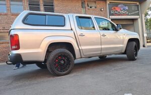 Picture shows image of a VW Amarok with custom painted callipers at Racers Paint and Panel