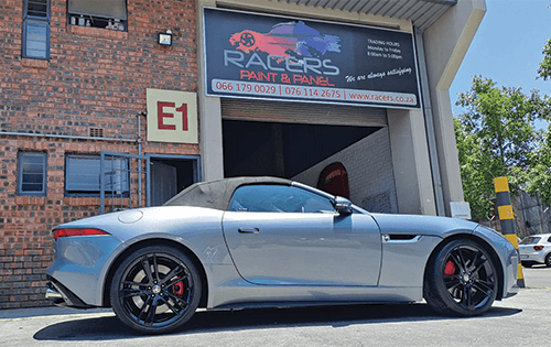 Jaguar F-Type with custom rims outside racers paint and pane - you can find out more About racers located in strydom park johannesburg