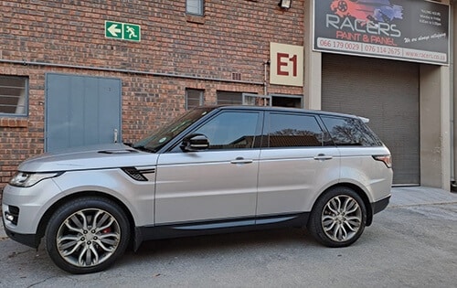 Racers Customs car before having custom brake callipers and mag rims parked outside racers paint and panel