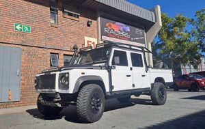 Land Rover parked outside racers paint and panel after dent repair