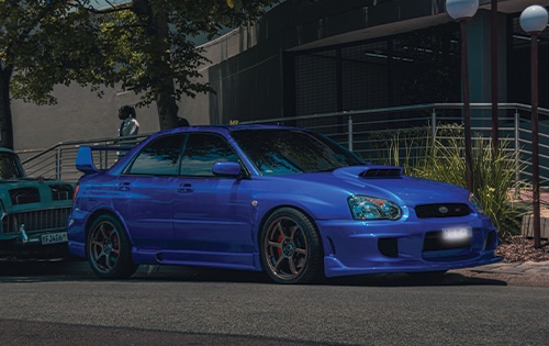 Image shows a subaru after a full car respray at racer paint and panel