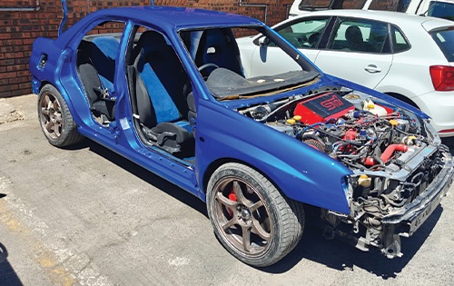 Image shows a subaru after full body respray in the process of being reassembled at racers paint and panel in johannesburg