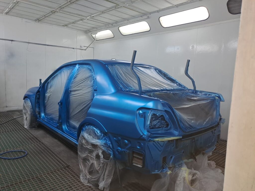 image shows a Subaru in the booth at Racers Paint and Panel in johannesburg for a full car respray